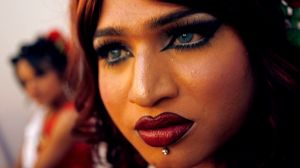 A contestant waits to get her make-up done before the finals of "Indian Super Queen" in Mumbai